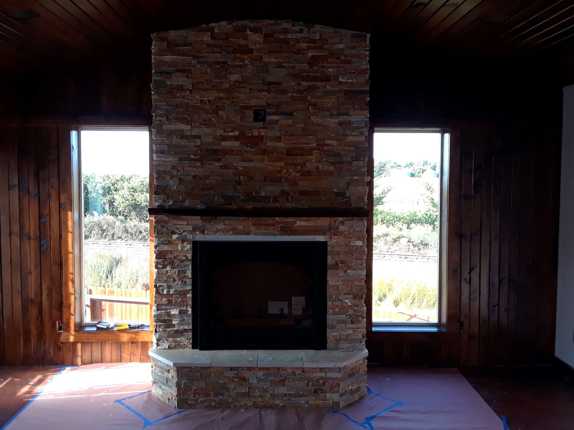 Stacked stone fireplace built by Granum Construction